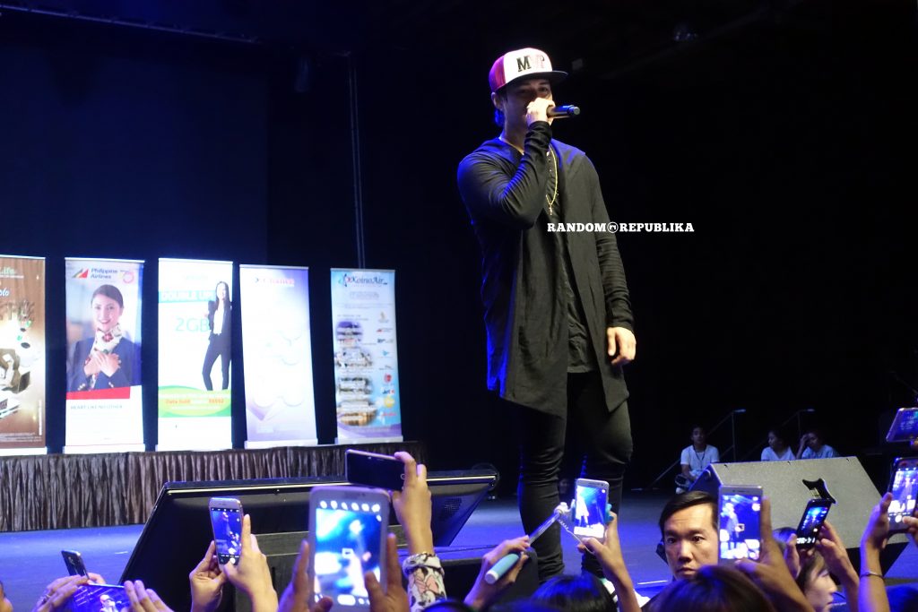 enrique gil with cap singing lizquen live in singapore with filipino dance club singapore
